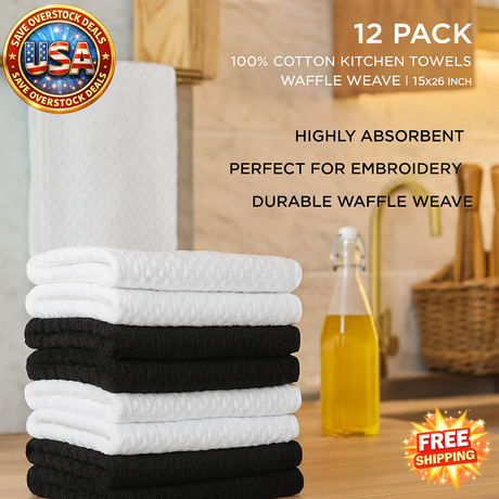 Stack of white and black kitchen towels with promotional text on a wooden surface.